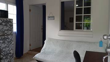 Apartment, Garden View, Poolside | Living area | 32-inch Smart TV with digital channels, TV, Netflix