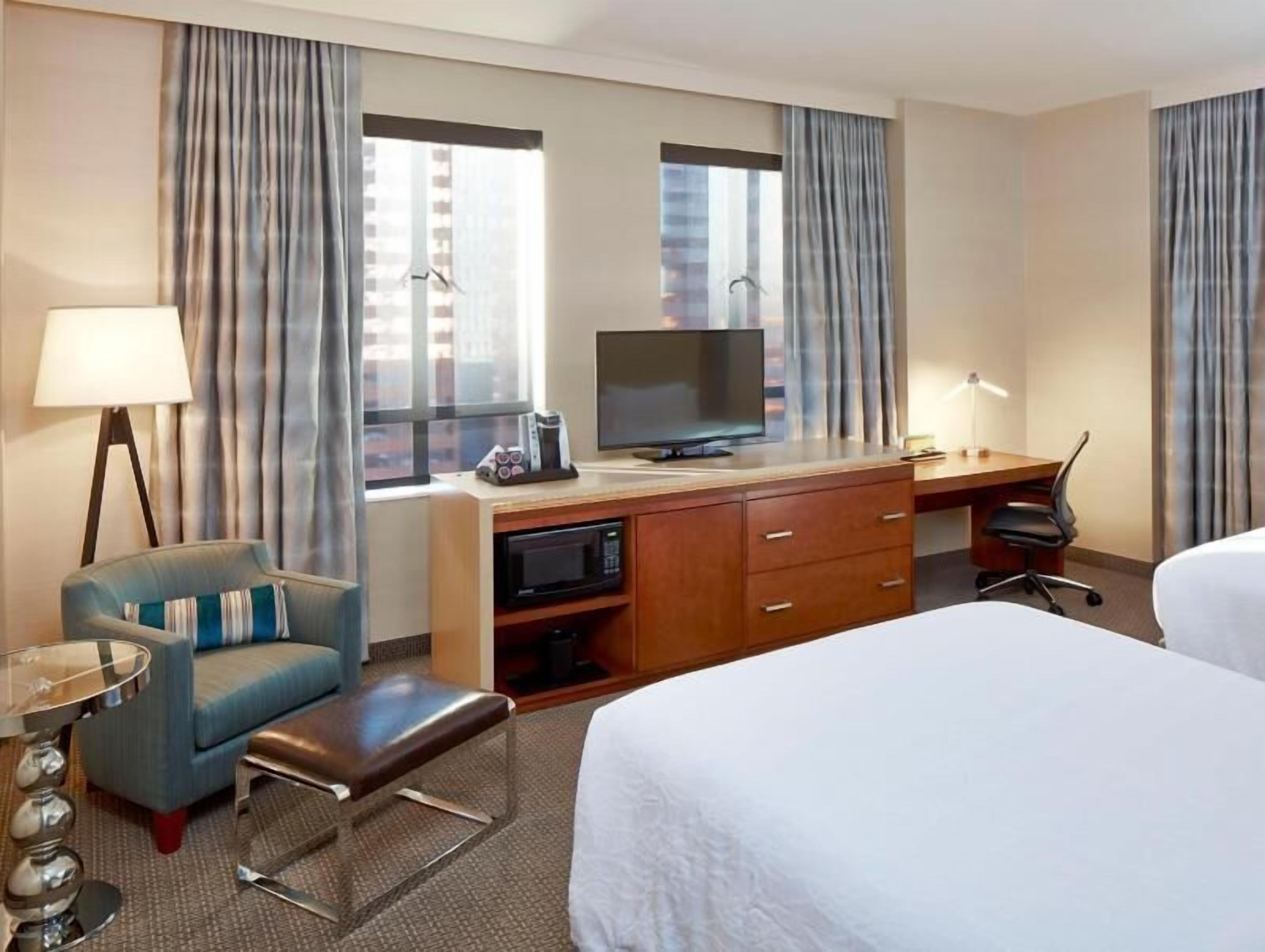 Premium bedding, pillow-top beds, desk, blackout curtains