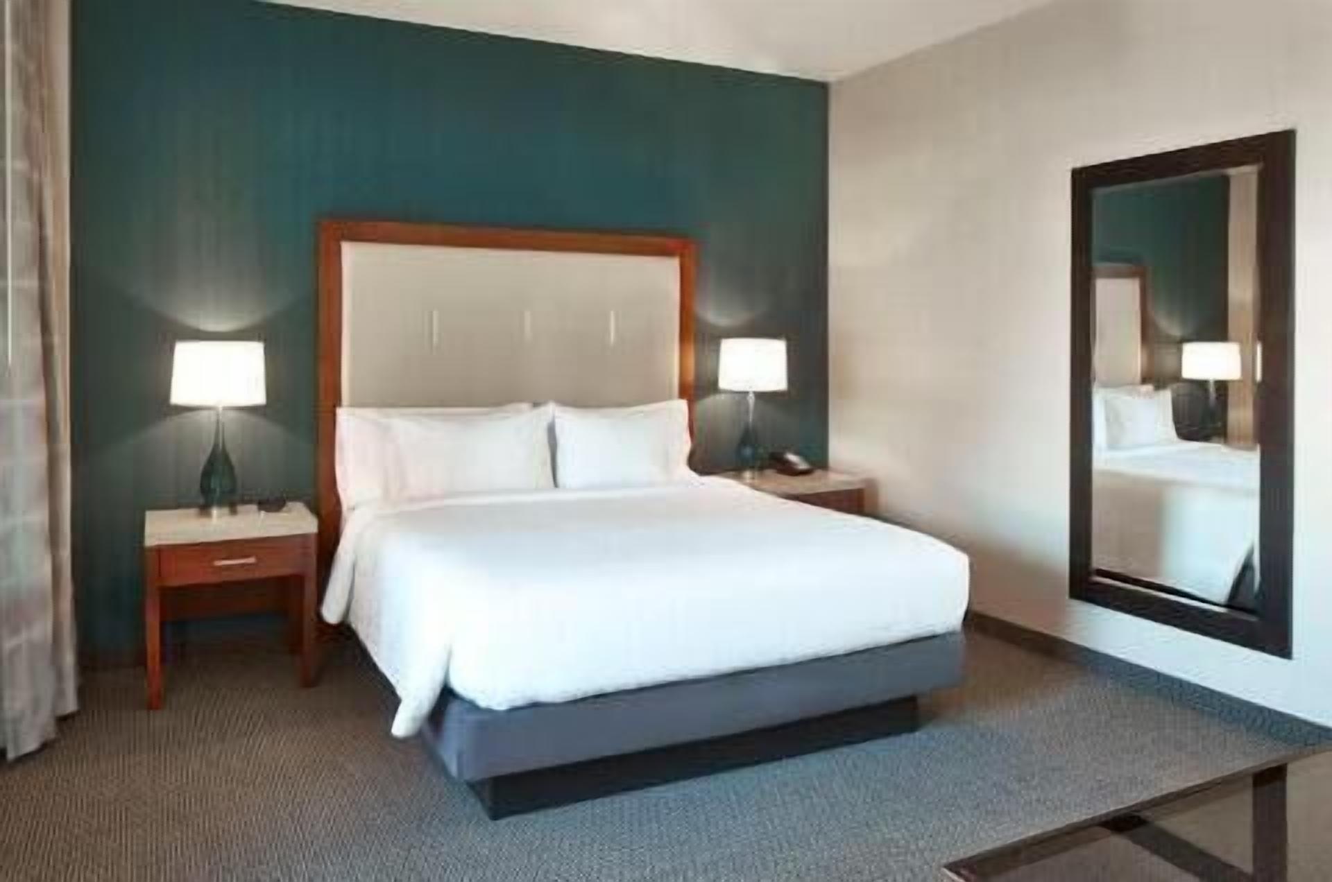 Premium bedding, pillow-top beds, desk, blackout curtains