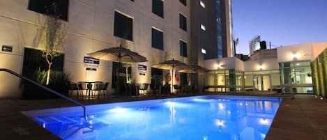 Outdoor pool, open 9:00 AM to 9:00 PM, pool umbrellas