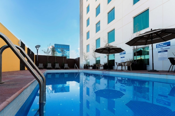 Outdoor pool, open 9:00 AM to 9:00 PM, pool umbrellas