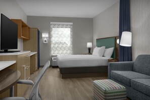 Suite estudio, 1 cama King size, para no fumadores | Área de sala de estar | Televisión de pantalla plana de 49 pulgadas con canales por cable 