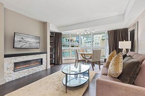 # 402 1 Bedroom Signature | Living area | 24-inch flat-screen TV with satellite channels, TV - Le Chamois by Whistler Premier (Whistler)
