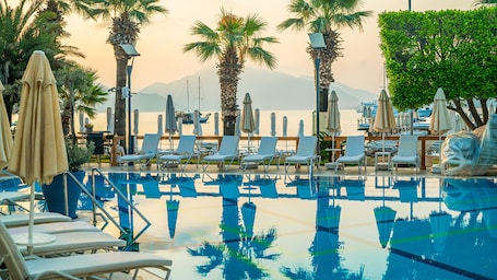 Outdoor pool, open 10 AM to 6:30 PM, pool umbrellas, sun loungers