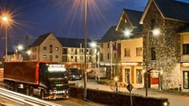 A hotel with a stone facade, multiple windows, and a sign indicating it is a hotel. - The Arches Hotel (Galway)