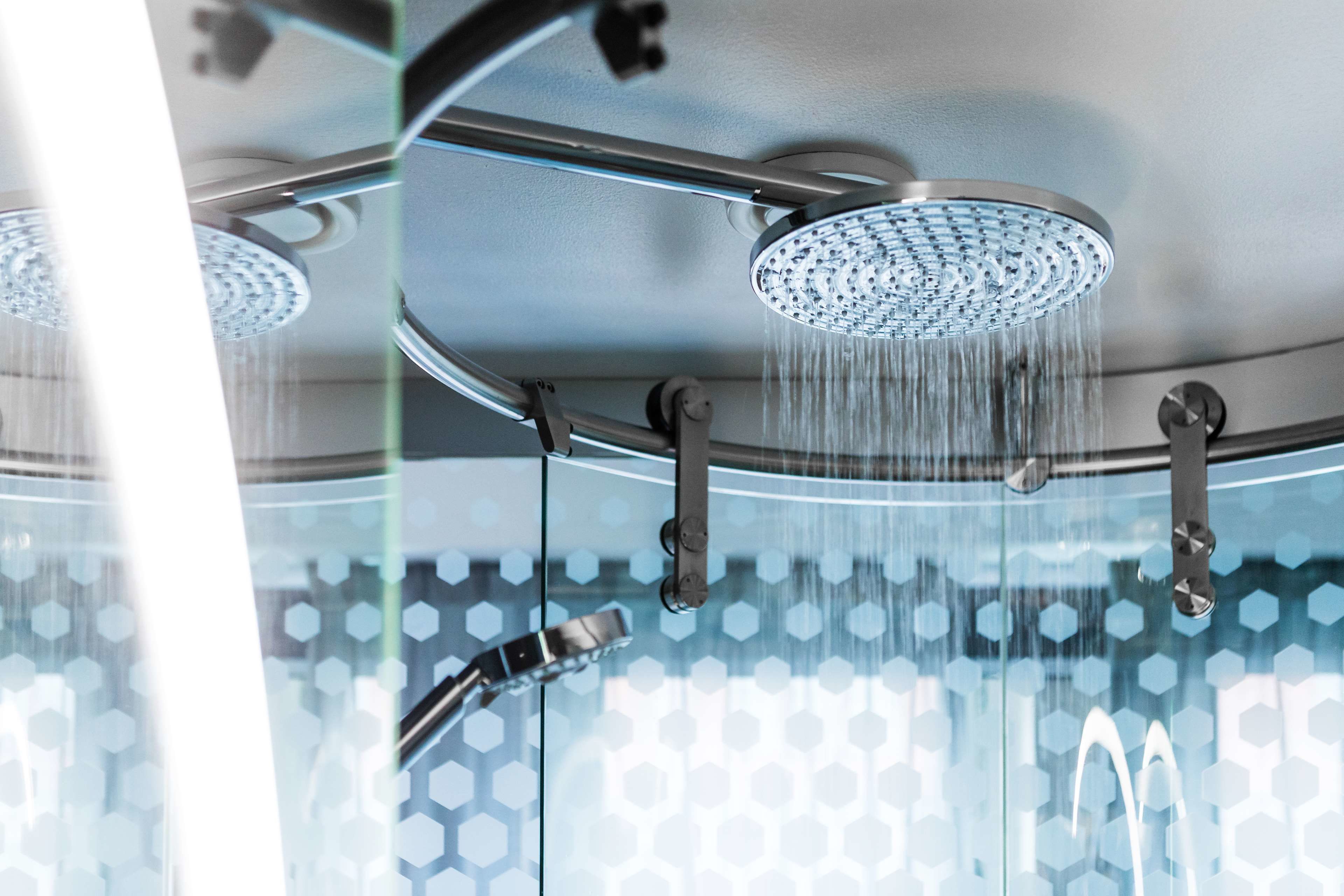 shower, rainfall showerhead, hair dryer, towels