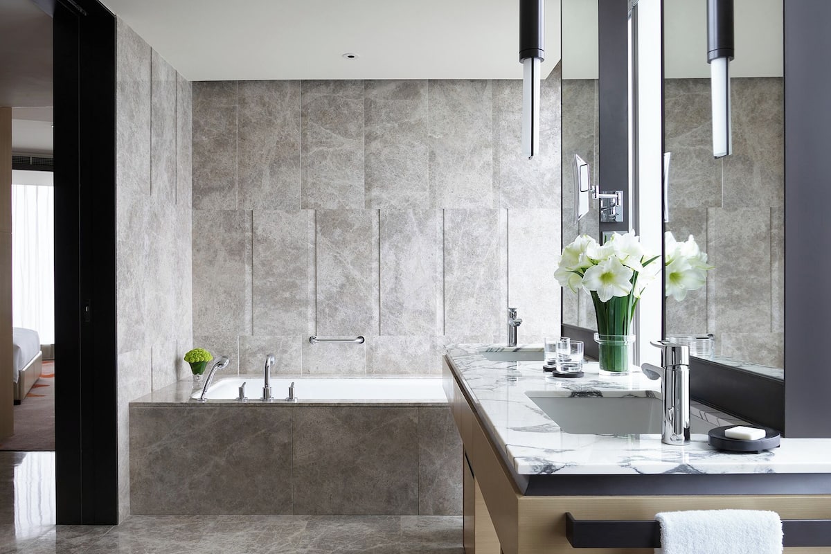 separate bathtub and shower, rainfall showerhead, designer toiletries