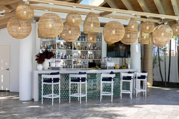 Outdoor pool, open 6:00 AM to 10:00 PM, pool umbrellas, sun loungers