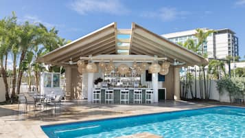 Outdoor pool, open 6:00 AM to 10:00 PM, pool umbrellas, sun loungers