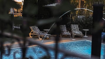 Outdoor pool, open 10:00 AM to 9:00 PM, pool loungers