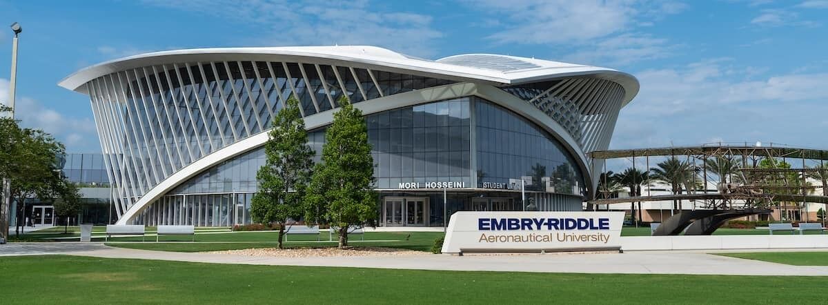 The Embry-Riddle Aeronautical University building with a modern, curved design and a sign indicating it's a student union.