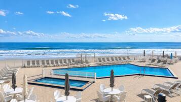 Outdoor pool, open 8:00 AM to midnight, pool umbrellas, sun loungers