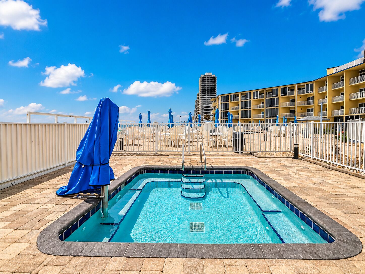 Outdoor pool, open 8:00 AM to midnight, pool umbrellas, pool loungers