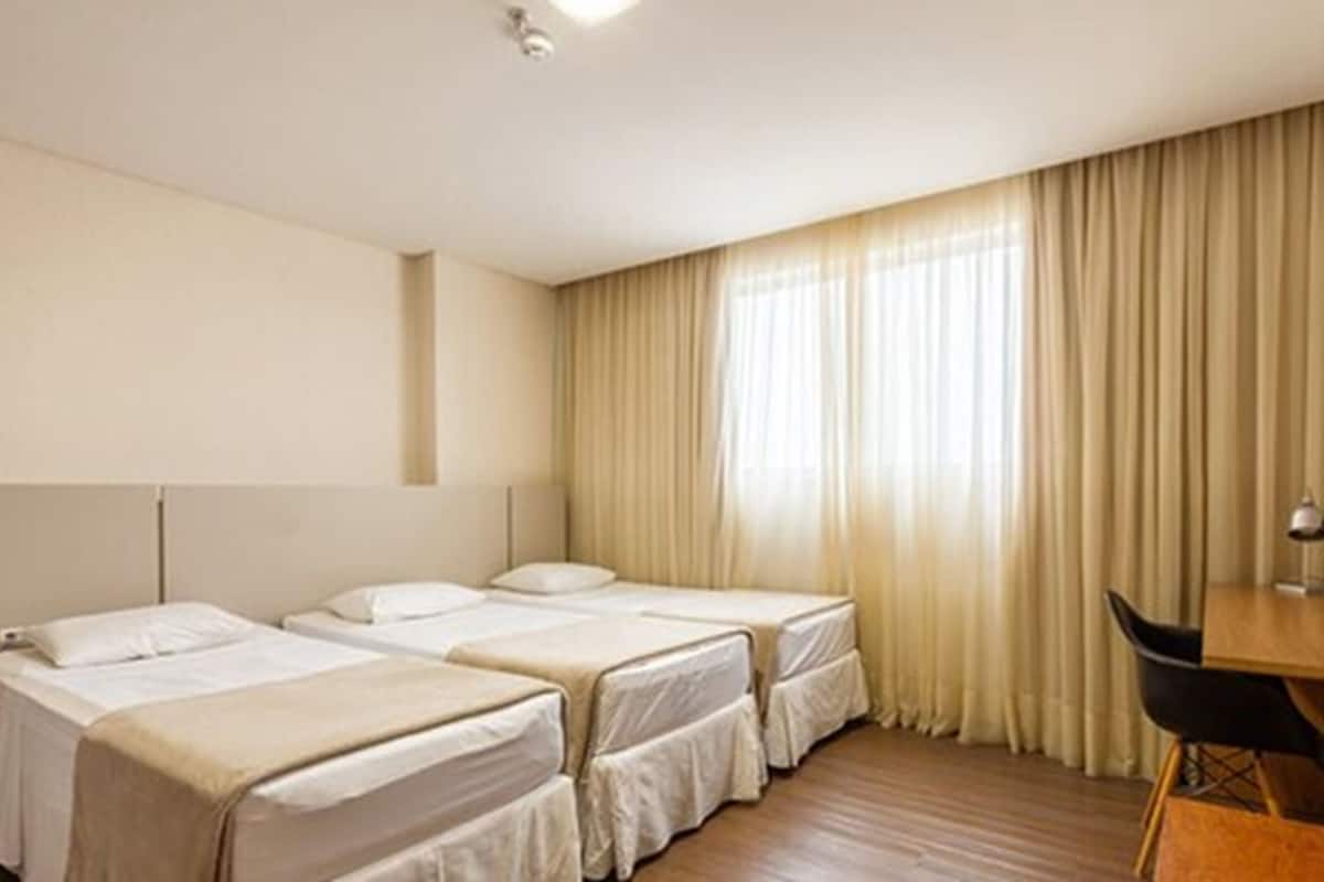 Deluxe Triple Room | Minibar, desk, blackout drapes, free WiFi