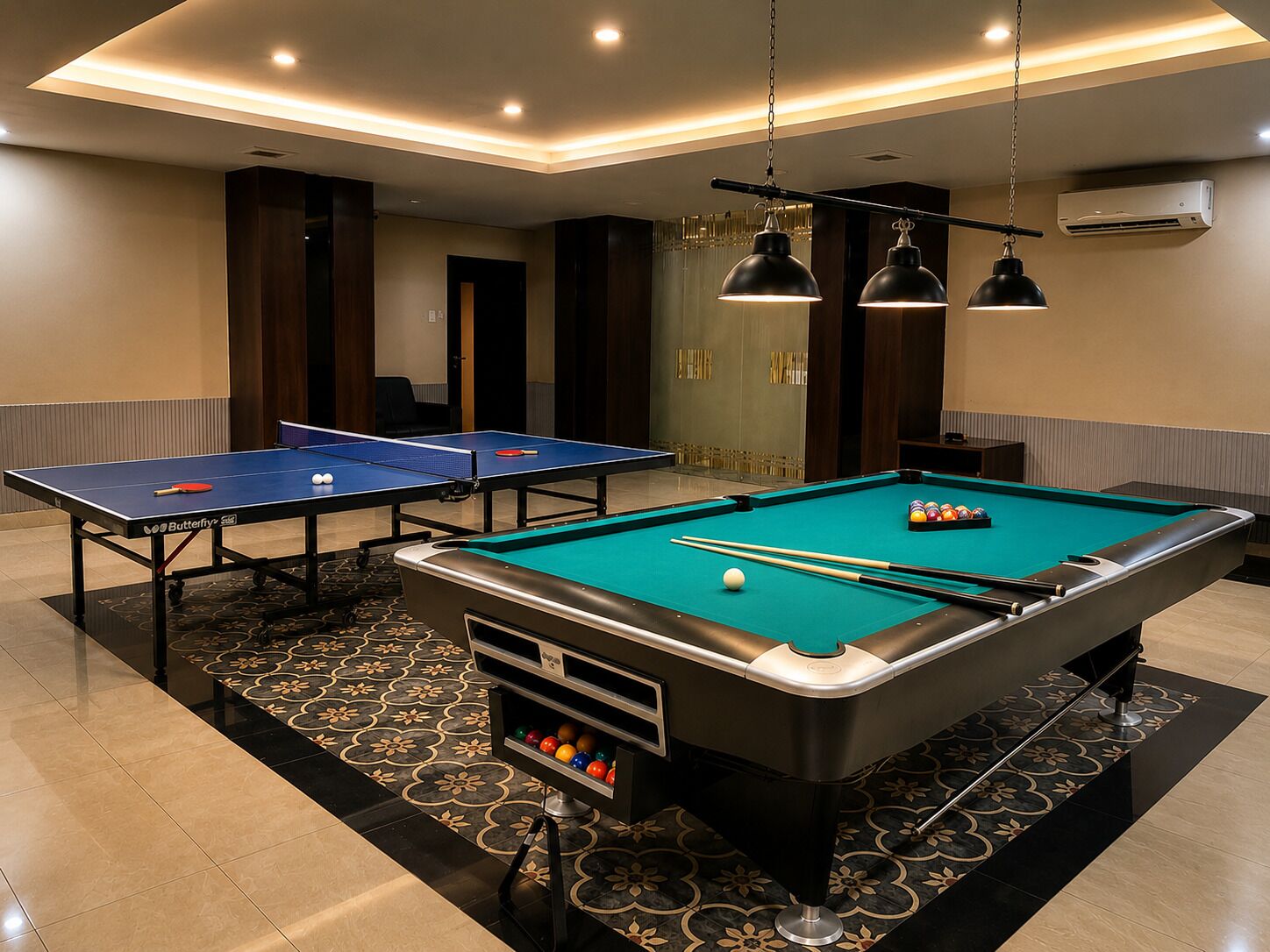 A pool table with a billiard cue, a ping pong table, and a pool table with balls and cues.