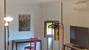 Triple Room | Living area | Flat-screen TV