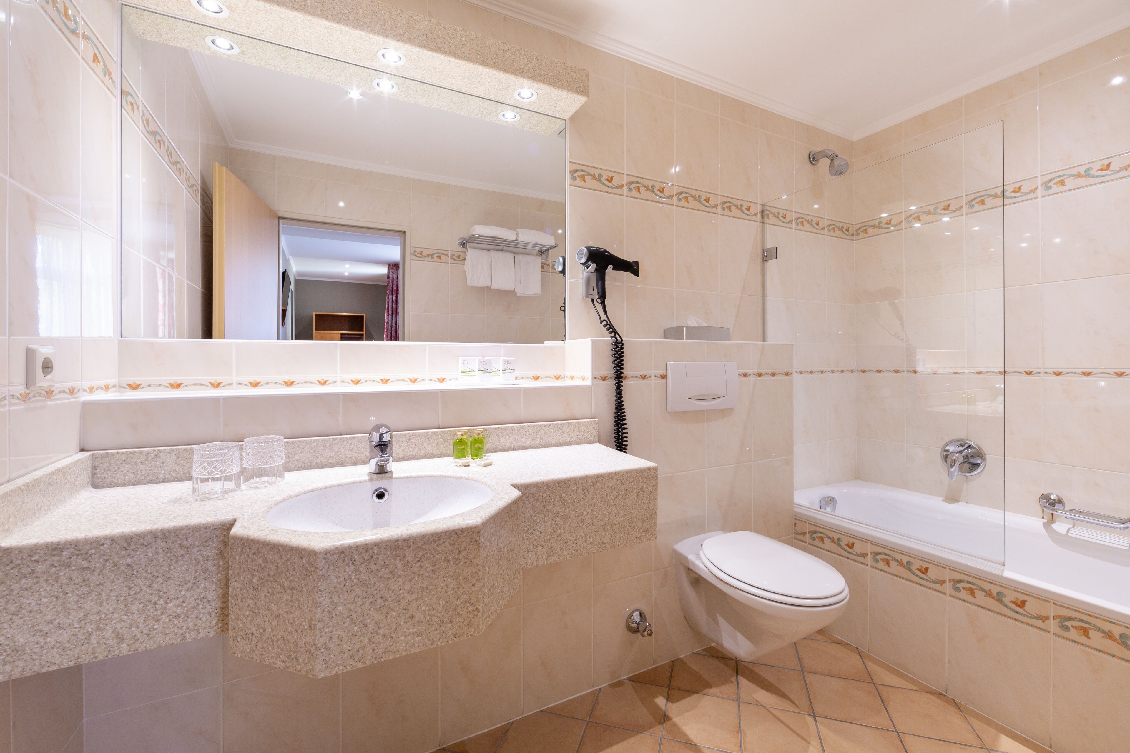 superior double room | bathroom | free toiletries, hair dryer, towels