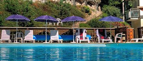 Seasonal outdoor pool, pool umbrellas, sun loungers