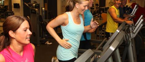 A gym with treadmills and exercise equipment.