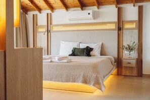 A modern bedroom with a bed, a nightstand, a wall-mounted air conditioner, and a wooden ceiling.