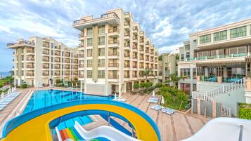 Relax by the pool with a family-friendly water slide and comfortable outdoor seating.