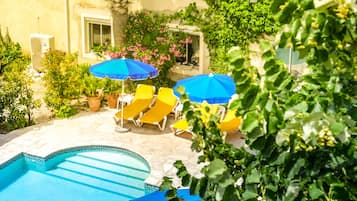 Seasonal outdoor pool, pool umbrellas, pool loungers