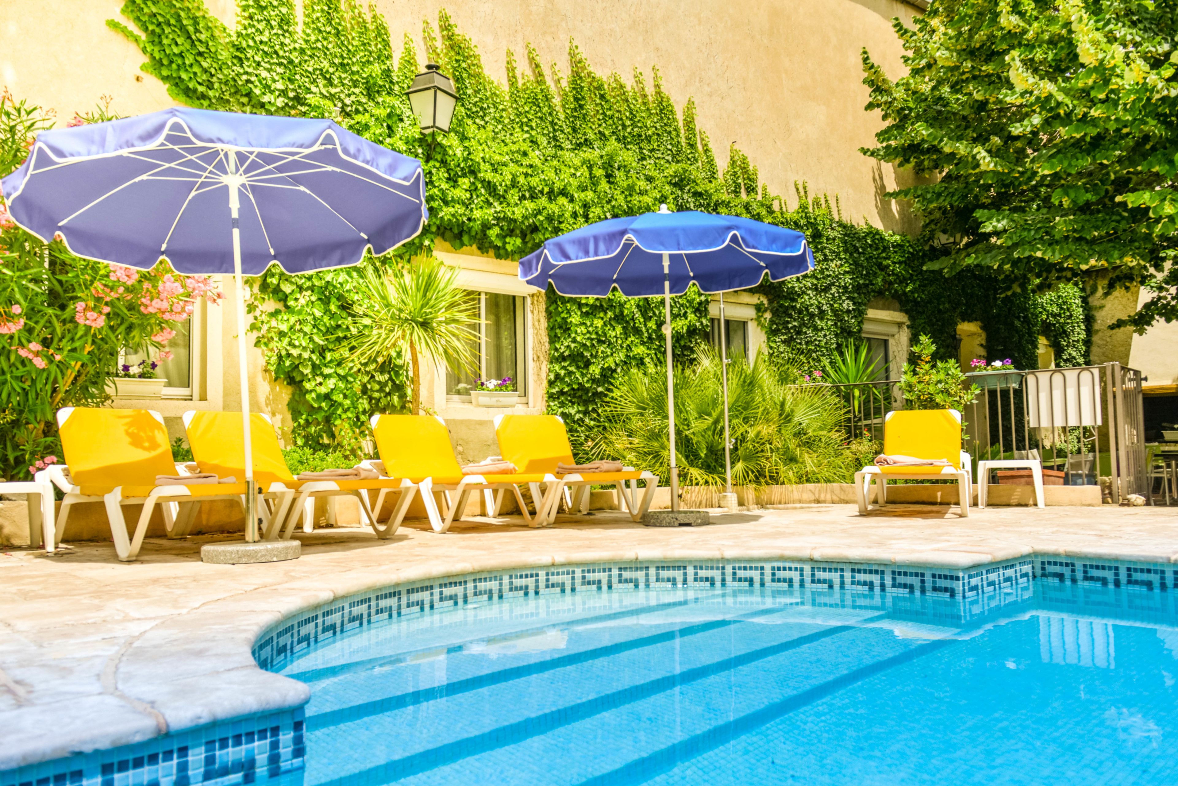 seasonal outdoor pool, open 9:30 am to 8 pm, pool umbrellas