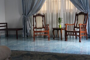 Family Suite, 1 King Bed | Living area | 32-inch LED TV with satellite channels - Natures Bliss Holidays (Ragama)