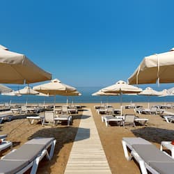 On the beach, sun loungers, beach umbrellas