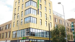 A multi-story hotel with a modern design, featuring large windows and a prominent signage for the Holiday Inn Express. - Holiday Inn Express London - Ealing by IHG (London)