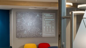 A map with location markers and a list of amenities including a Tube station, train station, bus stop, laundrette, pharmacy, ATM, Asda supermarket, and hospital. - Holiday Inn Express London - Ealing by IHG (London)