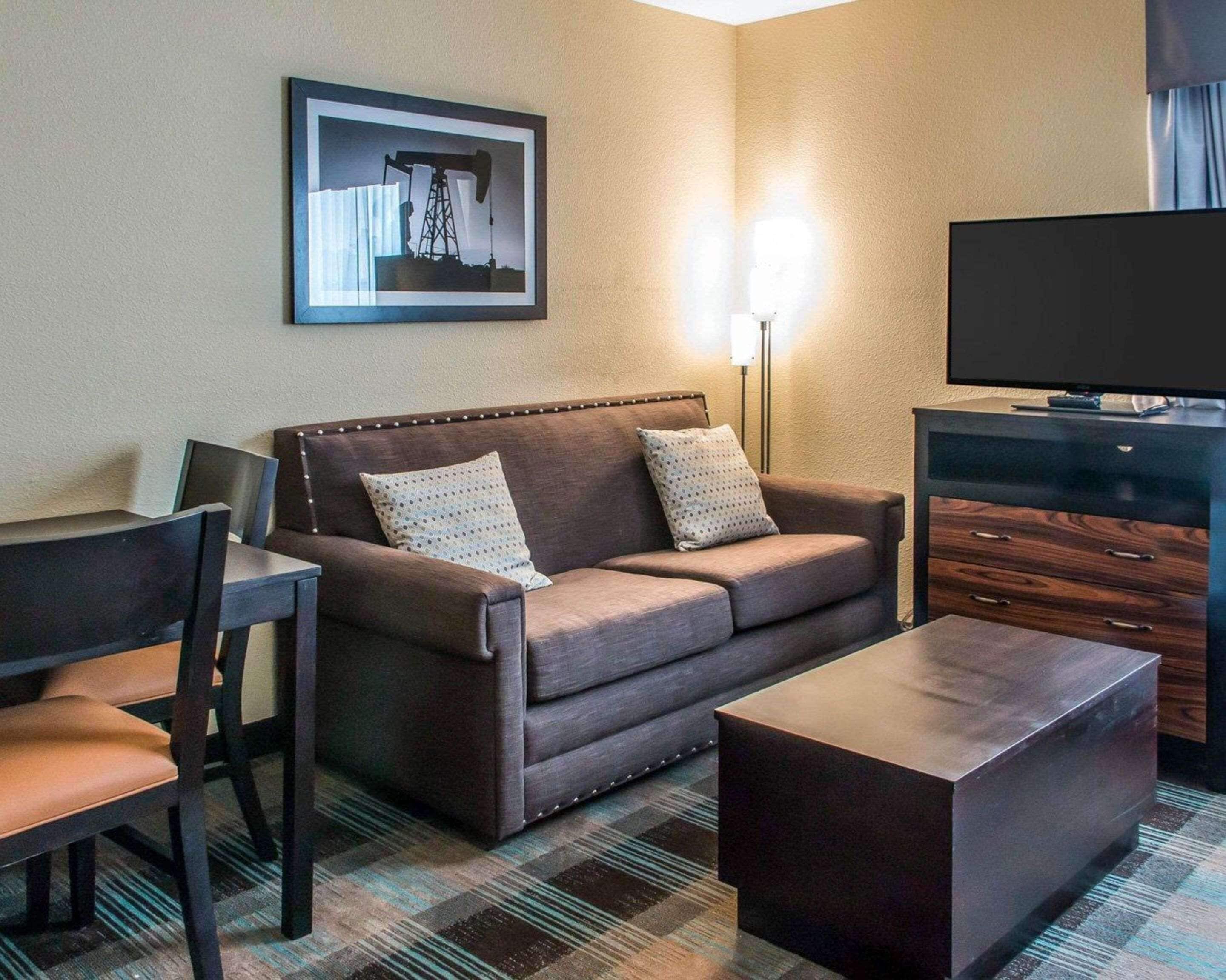 suite, 1 king bed with sofa bed, non smoking | pillow-top beds, desk, laptop workspace, iron/ironing board