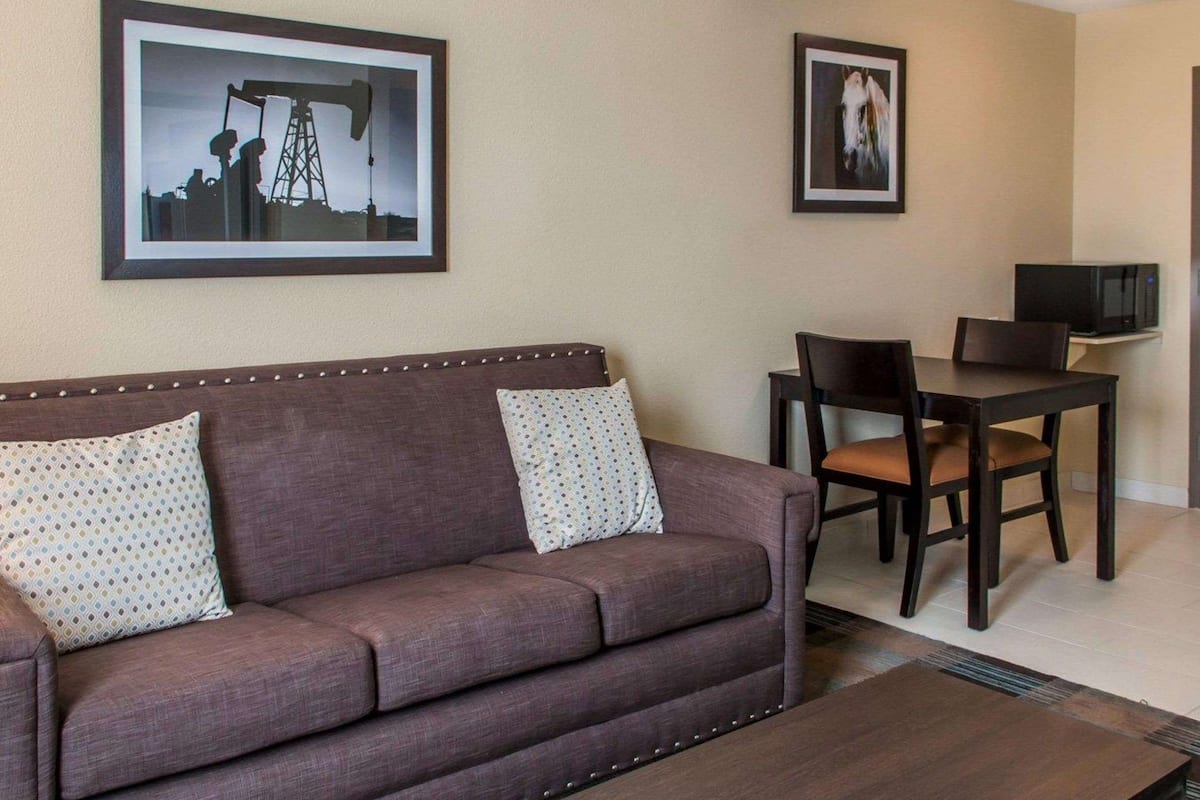 suite, 1 king bed with sofa bed, non smoking (2 person sofa bed) | pillow-top beds, desk, laptop workspace, iron/ironing board