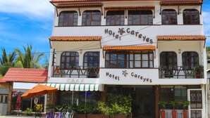 A two-story building with a sign reading "Hotel Careyes." - Hotel Careyes Puerto Escondido (Puerto Escondido)