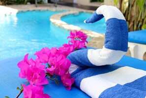 Outdoor pool, open 9:00 AM to 9:00 PM, sun loungers