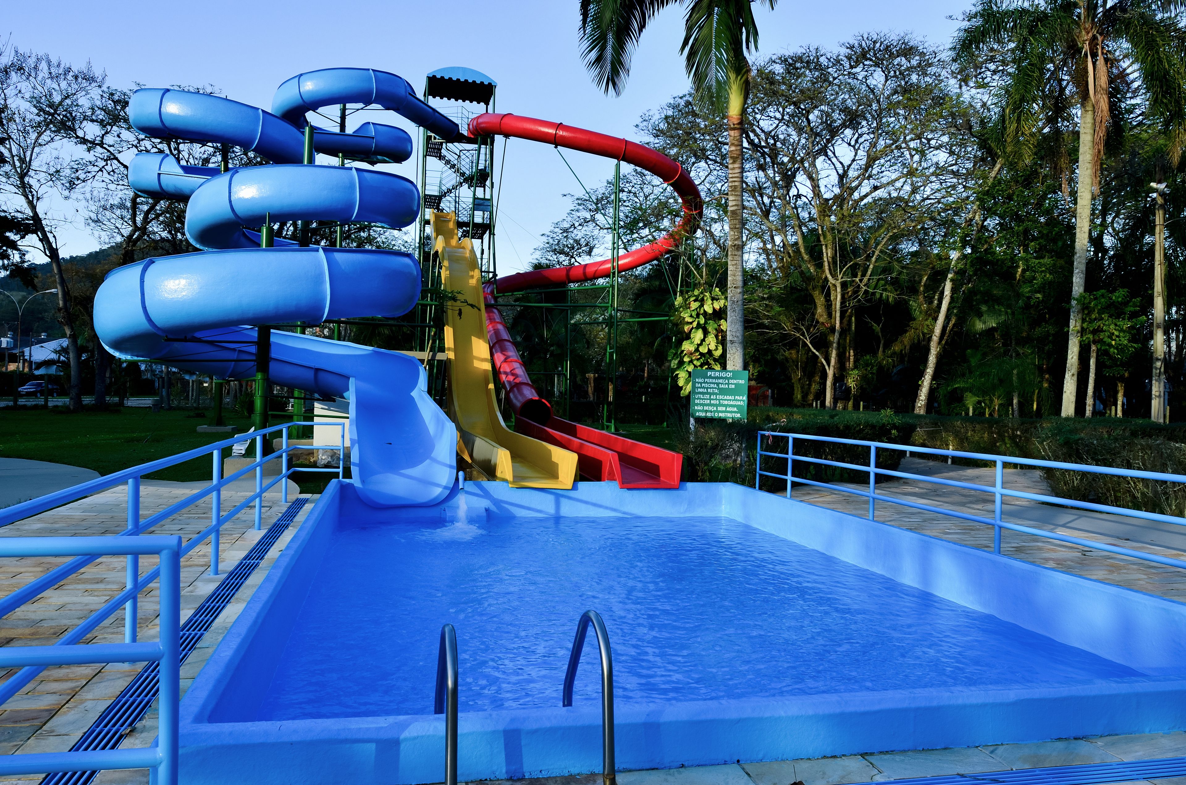 A water park with multiple slides and a pool area.