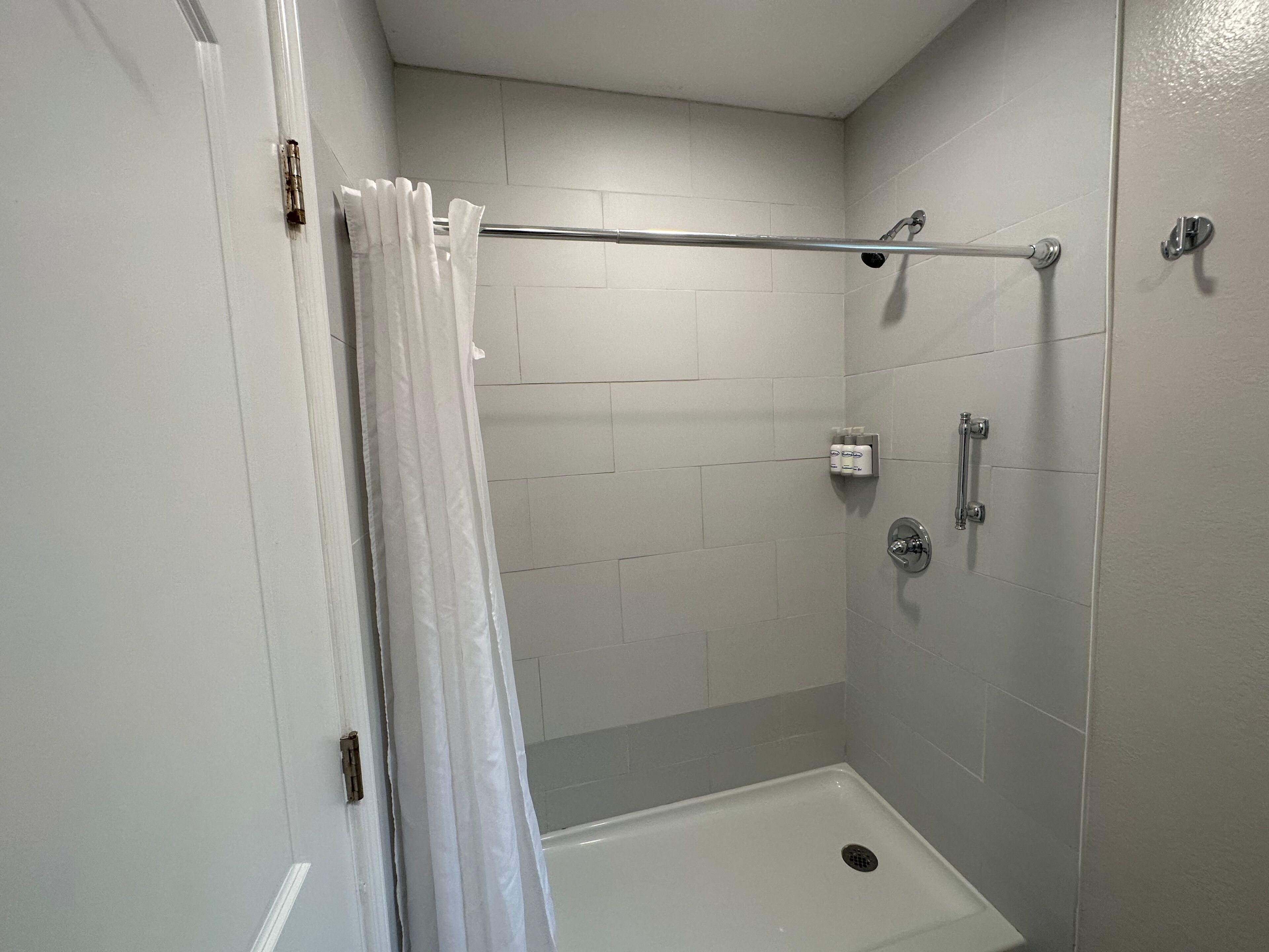 standard room, 2 queen beds | bathroom | shower, eco-friendly toiletries, hair dryer, towels