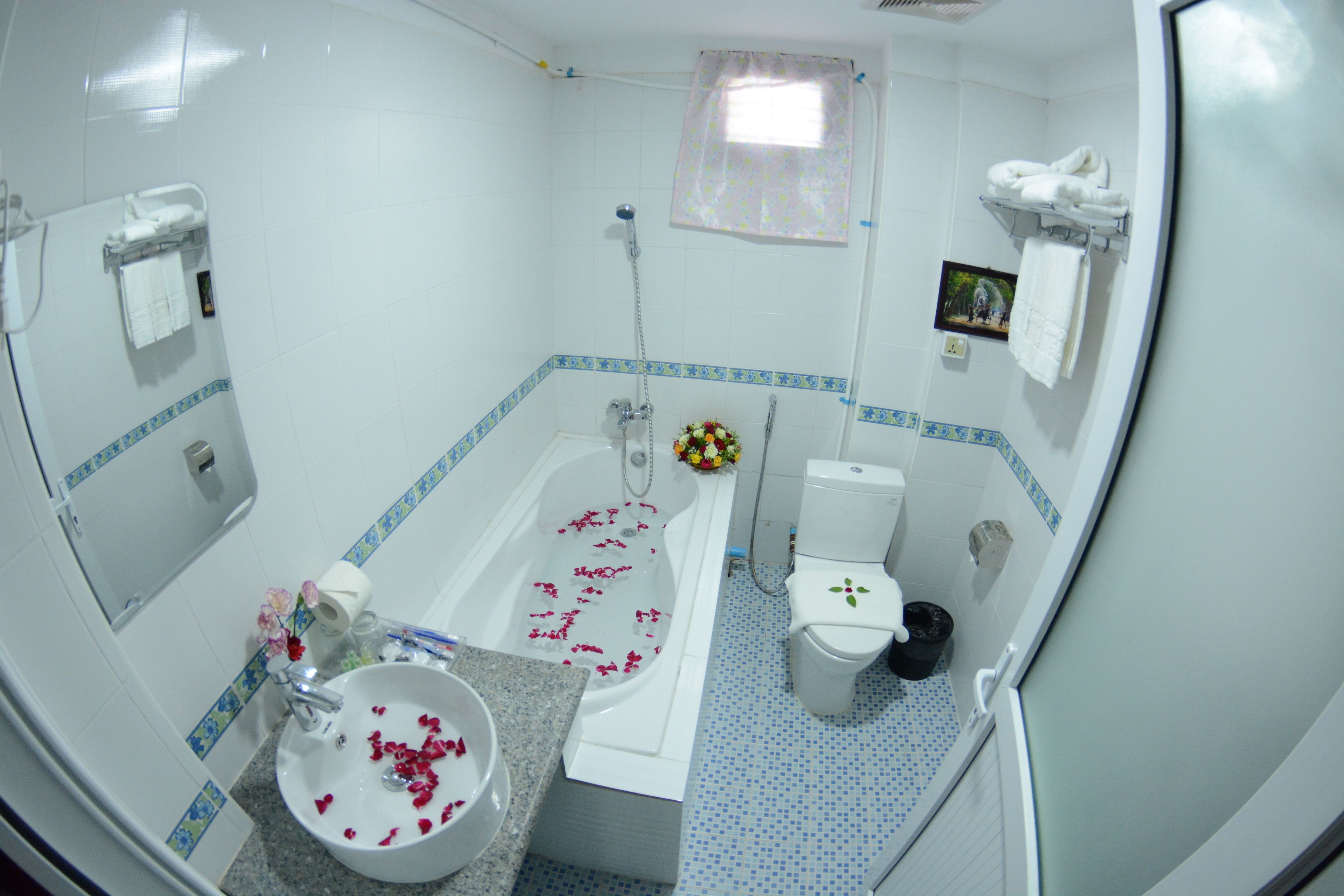 deluxe family room | bathroom | free toiletries, hair dryer, slippers, towels