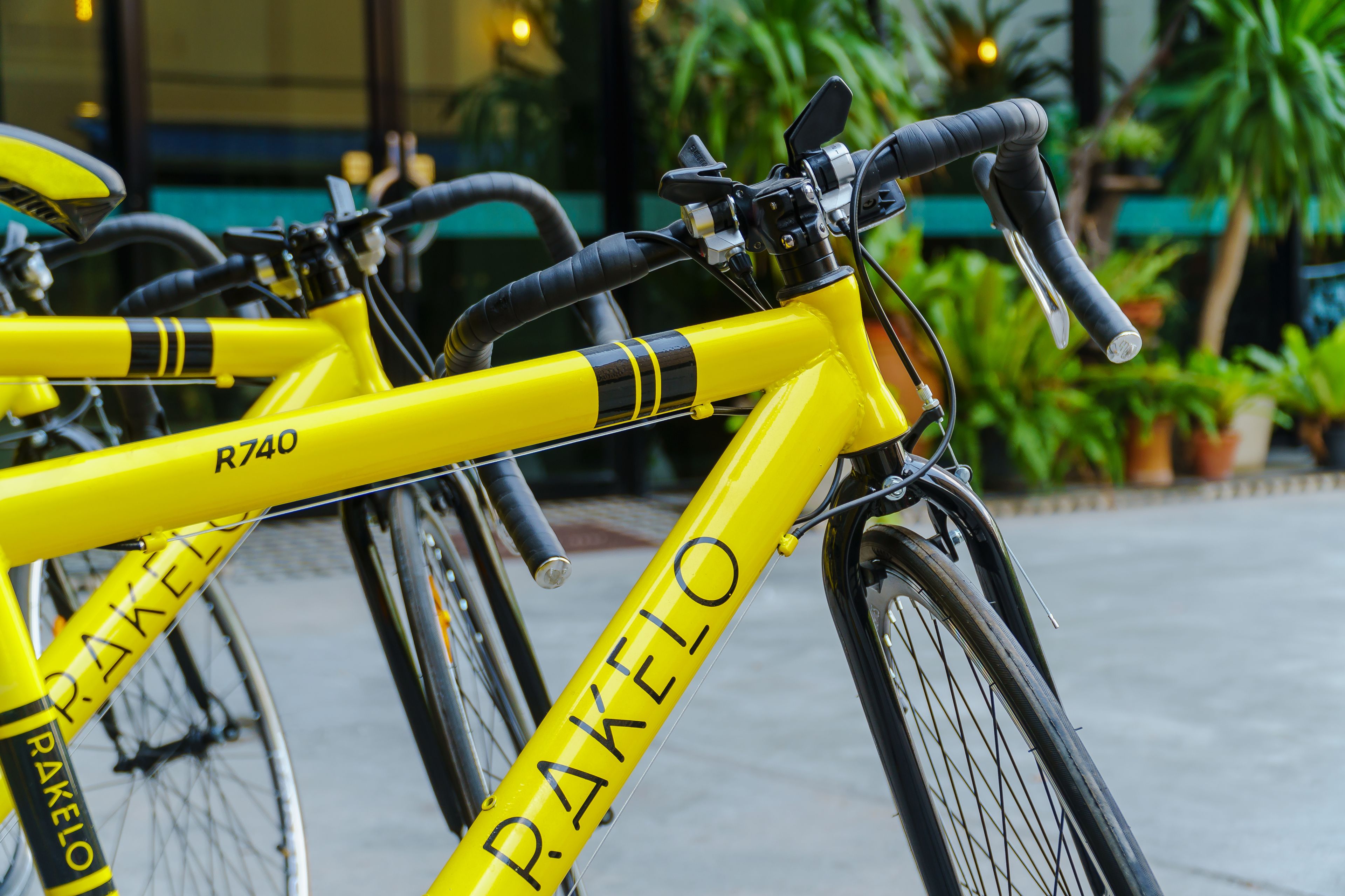 A yellow bicycle with the brand name "PAKELLO" and model number "R740" visible on the frame.