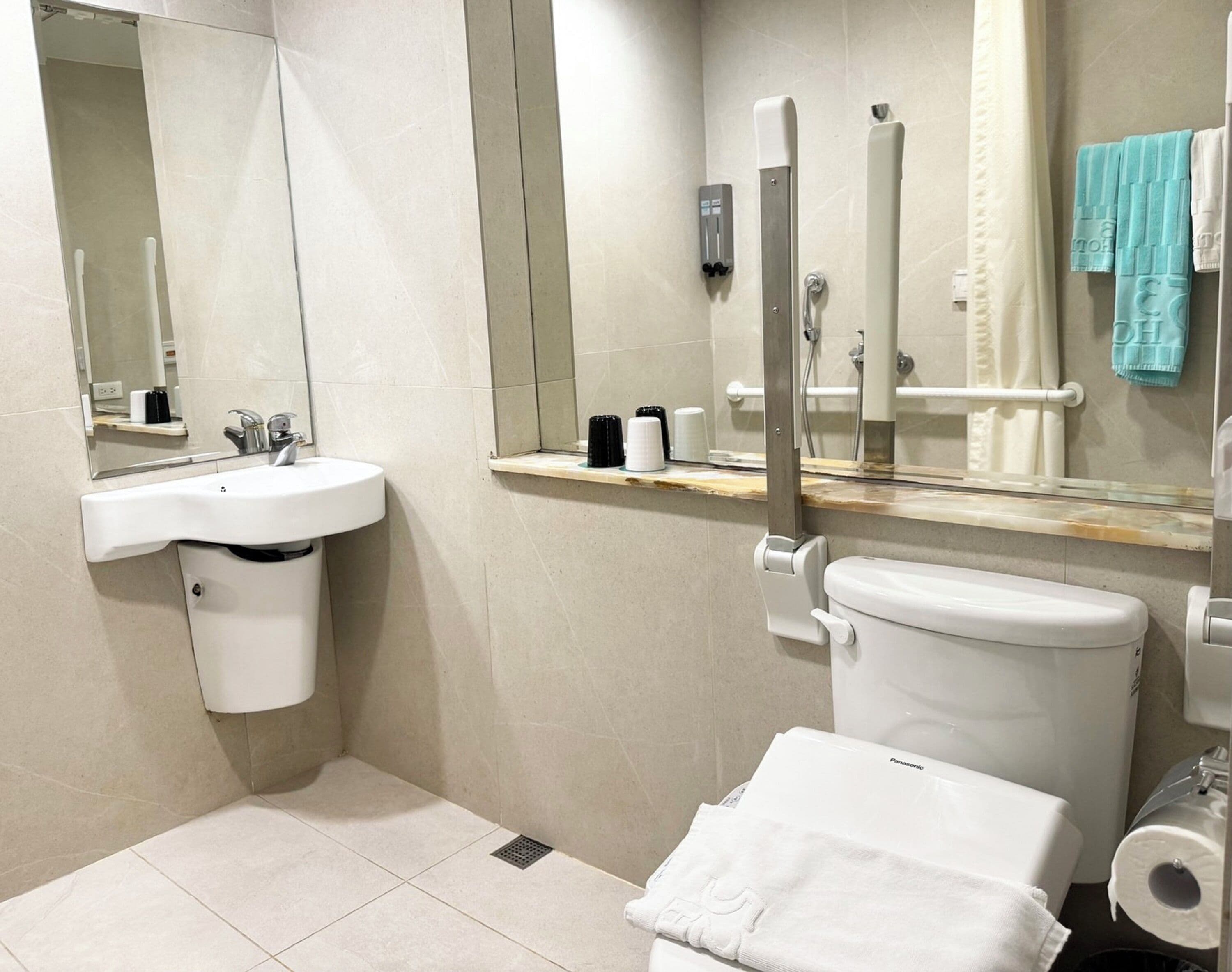 superior accessible room - no window no parking | bathroom | shower, rainfall showerhead, hair dryer, slippers