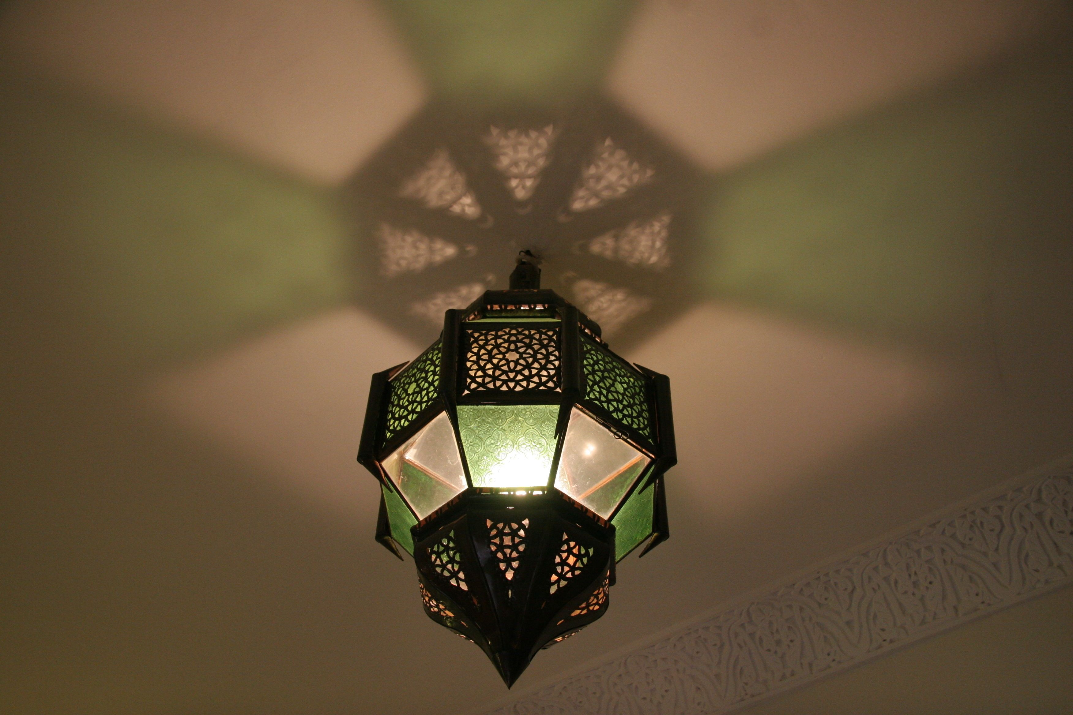 A traditional lantern with intricate patterns and a central light source.