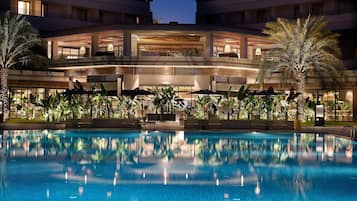 Indoor pool, outdoor pool, pool umbrellas, pool loungers