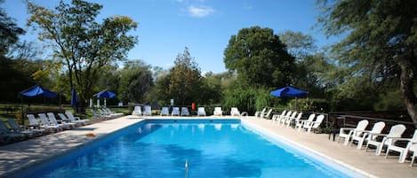 Indoor pool, seasonal outdoor pool, pool umbrellas, pool loungers