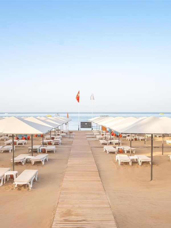 On the beach, sun loungers, beach umbrellas, beach towels