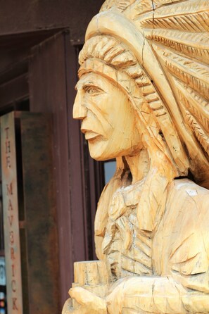 A detailed wooden carving of a historical figure.