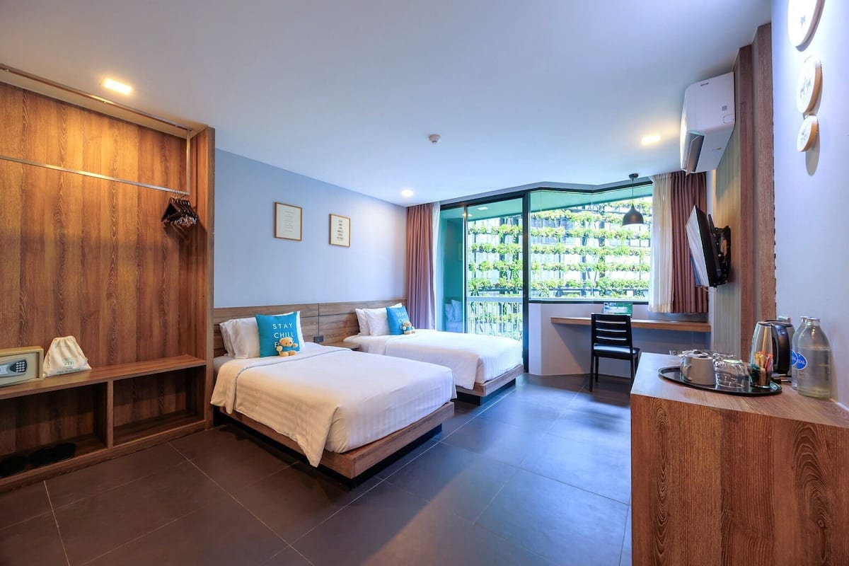 Chambre Deluxe | Literie de qualité, minibar, coffre-fort, bureau