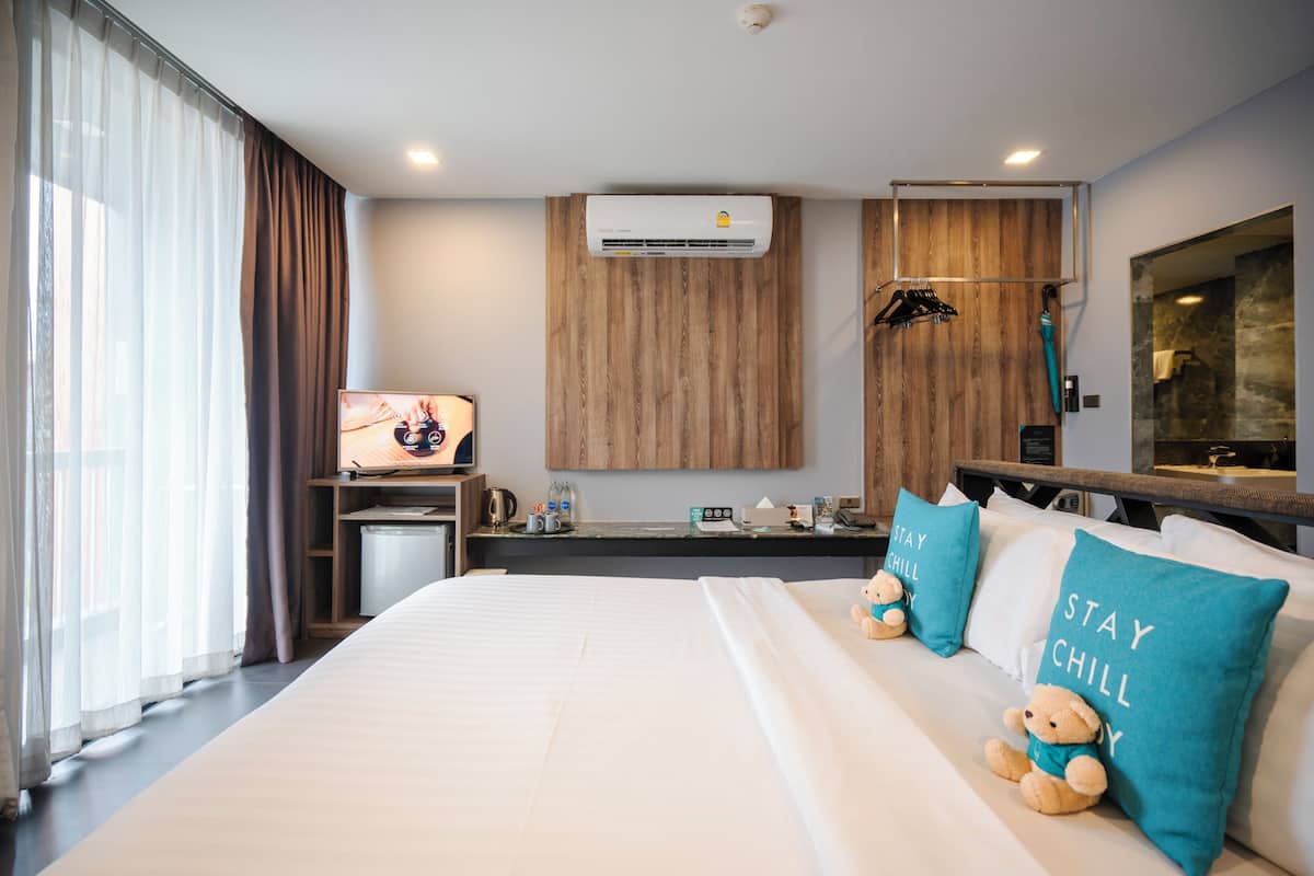 Habitación Deluxe | Ropa de cama de alta calidad y minibar