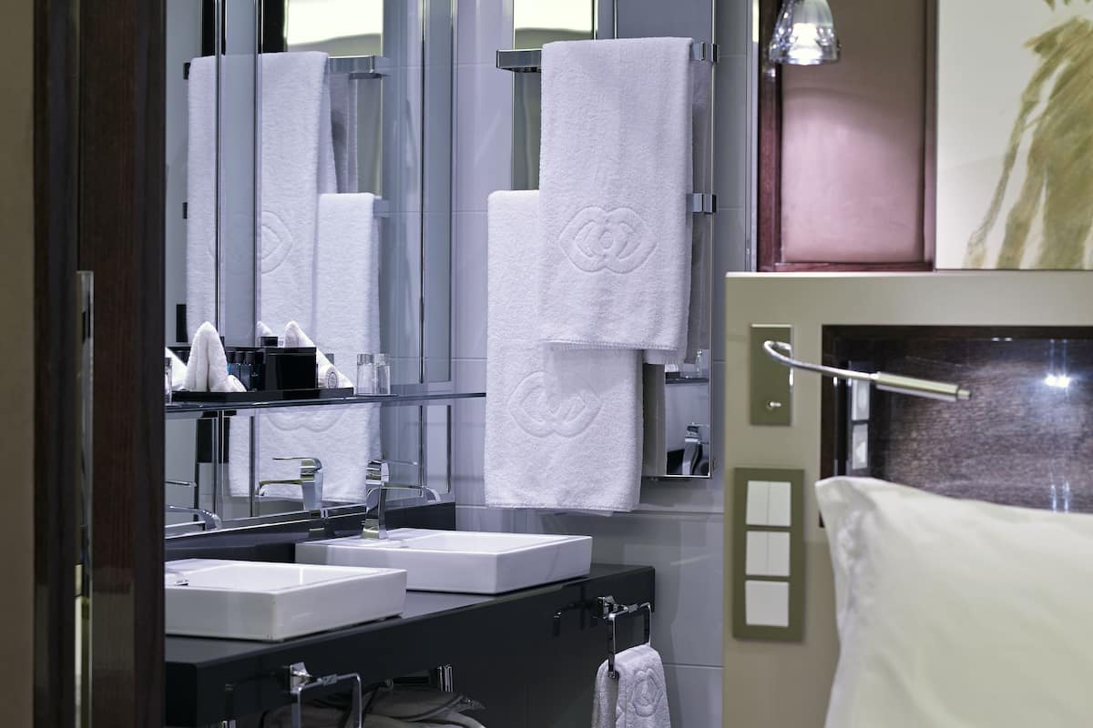 rainfall showerhead, designer toiletries, hair dryer, bathrobes