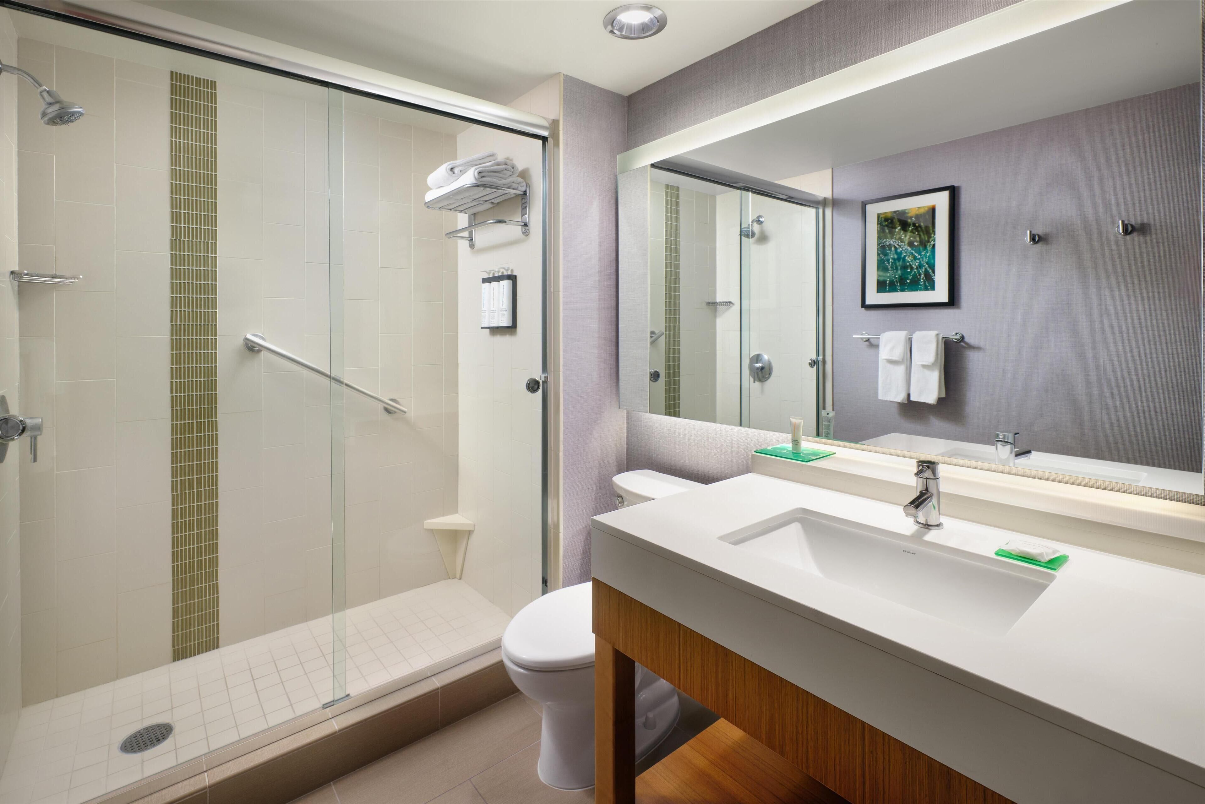 designer toiletries, hair dryer, towels