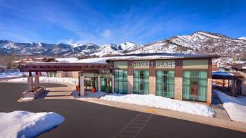 A Hyatt Place hotel with a modern design, featuring large windows and a covered entrance.